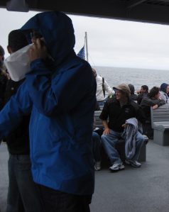 Using a puke bag on Boston Harbour Whale Tour